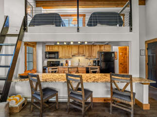 This stunning property boasts a modern kitchen with granite countertops and ample cabinet space, perfect for culinary enthusiasts.