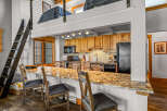 This stunning property boasts a modern kitchen with granite countertops and ample cabinet space, perfect for culinary enthusiasts.