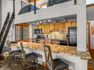 This stunning property boasts a modern kitchen with granite countertops and ample cabinet space, perfect for culinary enthusiasts.