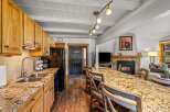 This stunning property boasts a spacious kitchen with granite countertops and ample cabinet space, perfect for culinary enthusiasts.
