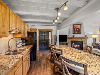 This stunning property boasts a spacious kitchen with granite countertops and ample cabinet space, perfect for culinary enthusiasts.