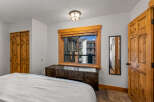 This inviting bedroom features a cozy atmosphere with natural wood accents.