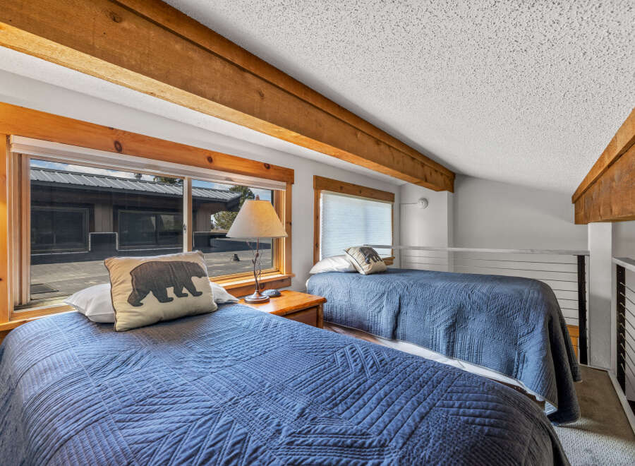 This cozy bedroom features two twin beds, perfect for a guest room or vacation rental.
