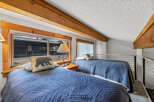 This cozy bedroom features two twin beds, perfect for a guest room or vacation rental.