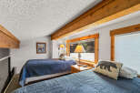 This cozy bedroom features two twin beds, perfect for a guest room or vacation rental.