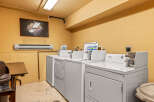 This laundry room offers convenient amenities for residents.