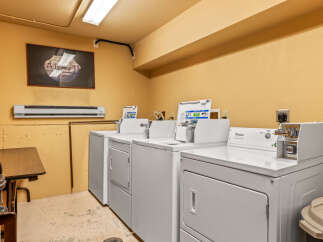 This laundry room offers convenient amenities for residents.