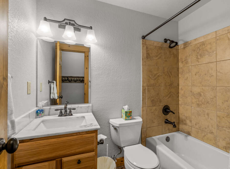 Step into this inviting bathroom featuring a classic design and functional layout.