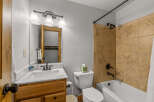 Step into this inviting bathroom featuring a classic design and functional layout.