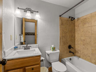 Step into this inviting bathroom featuring a classic design and functional layout.