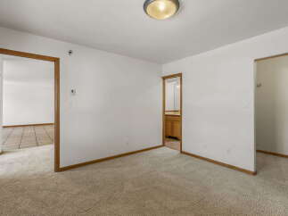 Step into this inviting space featuring a neutral color palette and ample natural light.