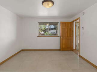 This inviting room features a bright and airy atmosphere, perfect for a variety of uses.