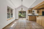 Step into this inviting dining area, featuring a stunning chandelier and a seamless flow to the outdoors.