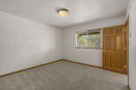 Step into this inviting room featuring a neutral color palette and plush carpeting, creating a cozy atmosphere.