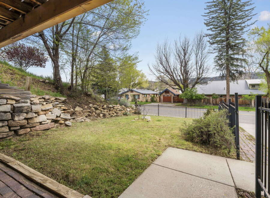 Discover the charm of this property, featuring a beautifully landscaped yard and a welcoming outdoor space.