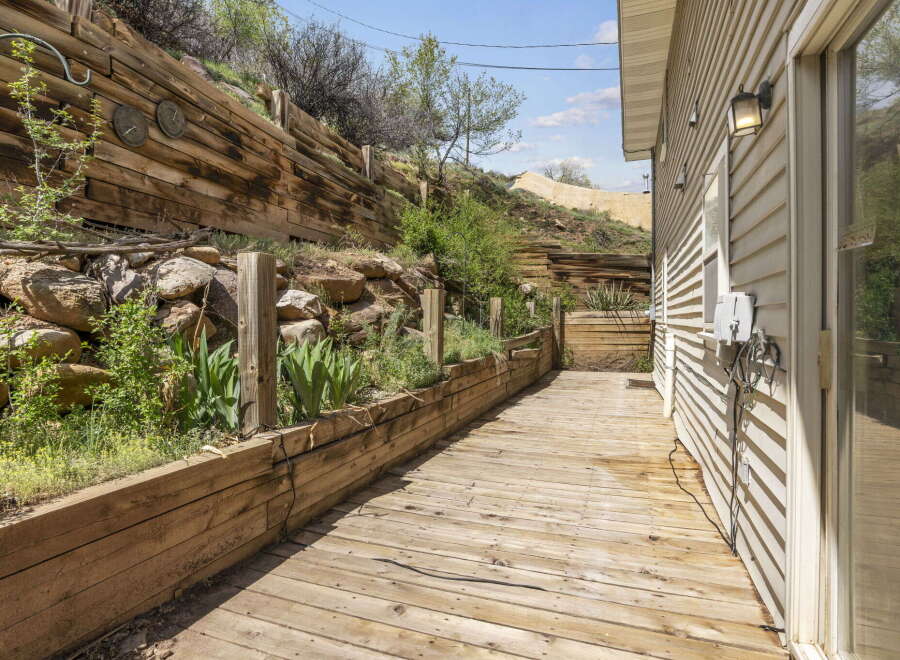 Discover the charm of this property featuring a beautifully designed wooden deck, perfect for outdoor relaxation and entertainment.