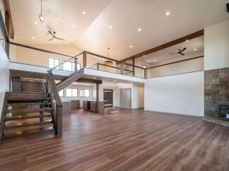 Step into luxury with this stunning property featuring a spacious open floor plan and a modern aesthetic.