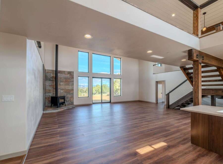 Step into luxury with this stunning property featuring expansive windows that flood the space with natural light.