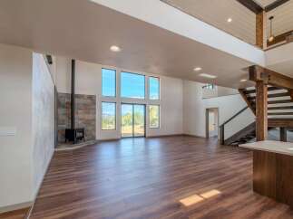 Step into luxury with this stunning property featuring expansive windows that flood the space with natural light.