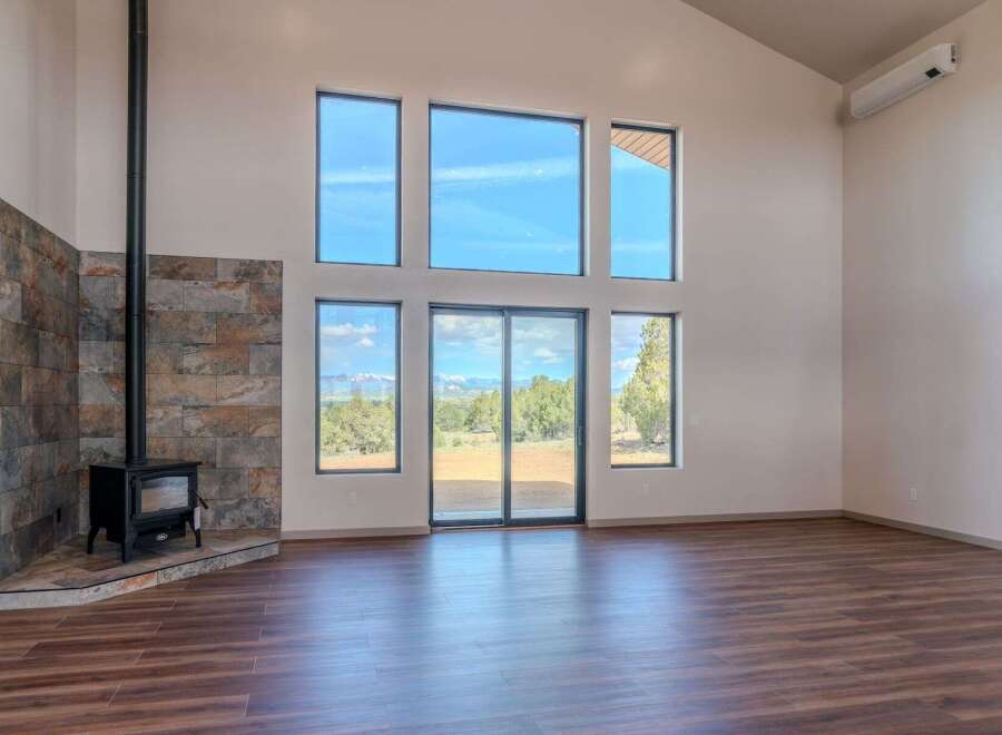 Experience the epitome of modern living in this stunning property, featuring expansive windows that flood the interior with natural light and offer breathtaking views.