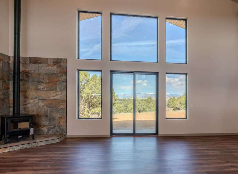 Experience the epitome of modern living in this stunning property, featuring expansive windows that flood the space with natural light.