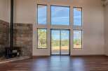 Experience the epitome of modern living in this stunning property, featuring expansive windows that flood the space with natural light.