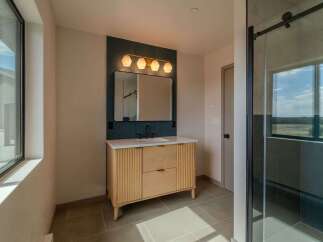 Step into modern elegance with this stunning bathroom design.