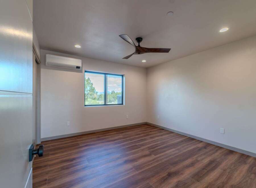 Step into this beautifully designed bedroom, featuring a modern aesthetic and ample natural light.