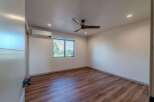 Step into this beautifully designed bedroom, featuring a modern aesthetic and ample natural light.