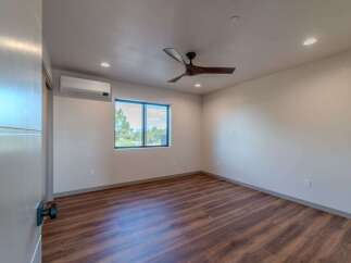 Step into this beautifully designed bedroom, featuring a modern aesthetic and ample natural light.