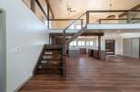 Step into luxury with this stunning property featuring a modern open floor plan and exquisite wooden accents.