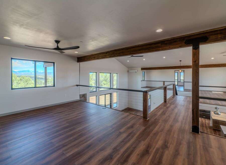 This stunning property boasts a modern open-concept design with a spacious loft area.