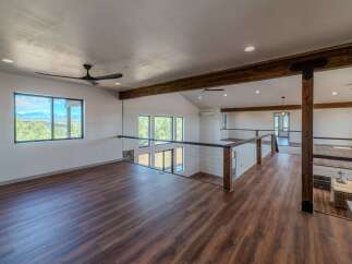 This stunning property boasts a modern open-concept design with a spacious loft area.