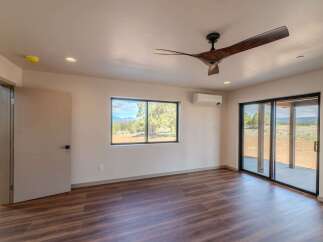 Step into modern elegance with this stunning property, featuring a spacious interior with beautiful hardwood floors.