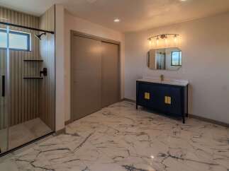 Step into luxury with this stunning bathroom featuring a modern design.