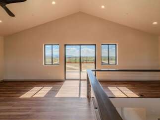 Step into this stunning modern home and be captivated by its open-concept design and breathtaking views.