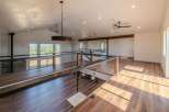 This stunning property boasts a modern, open-concept design with a spacious loft area.