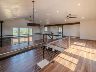 This stunning property boasts a modern, open-concept design with a spacious loft area.