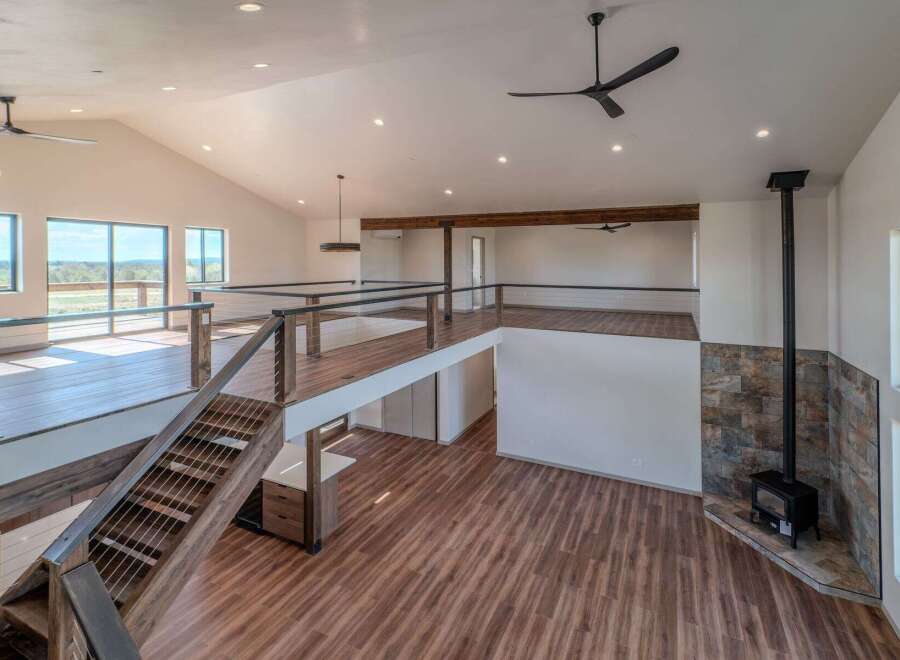 This stunning property boasts a modern, open-concept design with high ceilings and ample natural light.