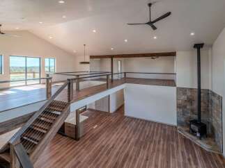 This stunning property boasts a modern, open-concept design with high ceilings and ample natural light.