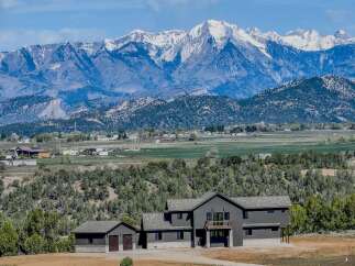 This stunning property offers breathtaking mountain views and a serene, natural setting.