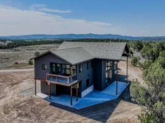 This stunning modern home offers breathtaking views and luxurious living.