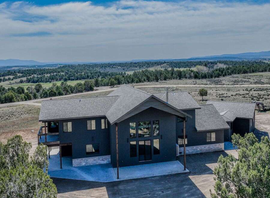 Discover your dream home in this stunning property! This modern residence boasts a sleek design with expansive windows, offering breathtaking views of the surrounding landscape.