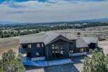 Discover your dream home in this stunning property! This modern residence boasts a sleek design with expansive windows, offering breathtaking views of the surrounding landscape.