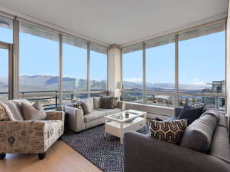 Experience breathtaking views from this stunning condo with floor-to-ceiling windows.