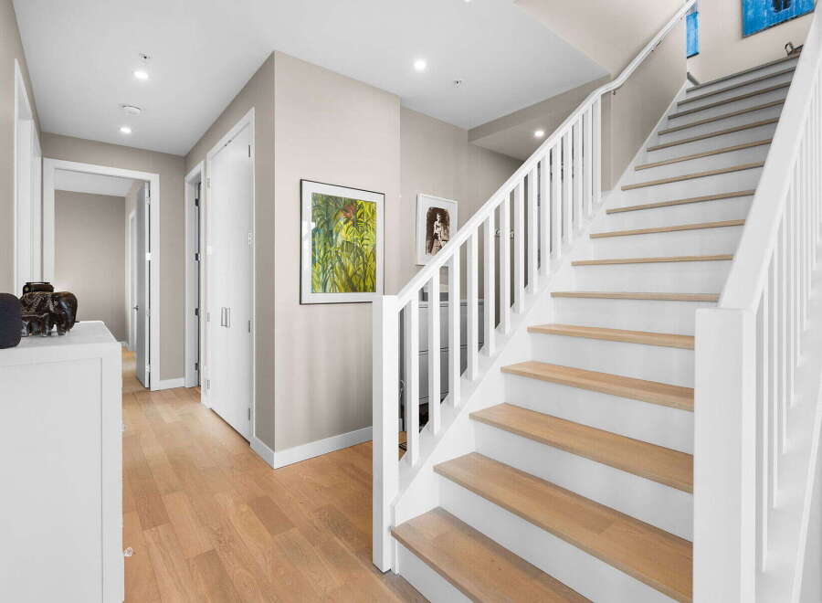 This stunning property boasts a modern interior with a bright and airy staircase.