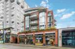 Discover modern urban living in this vibrant building featuring a mix of residential and commercial spaces.
