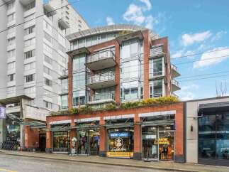 Discover modern urban living in this vibrant building featuring a mix of residential and commercial spaces.