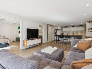 Step into modern living with this stunning property, featuring a spacious open-concept design perfect for entertaining.