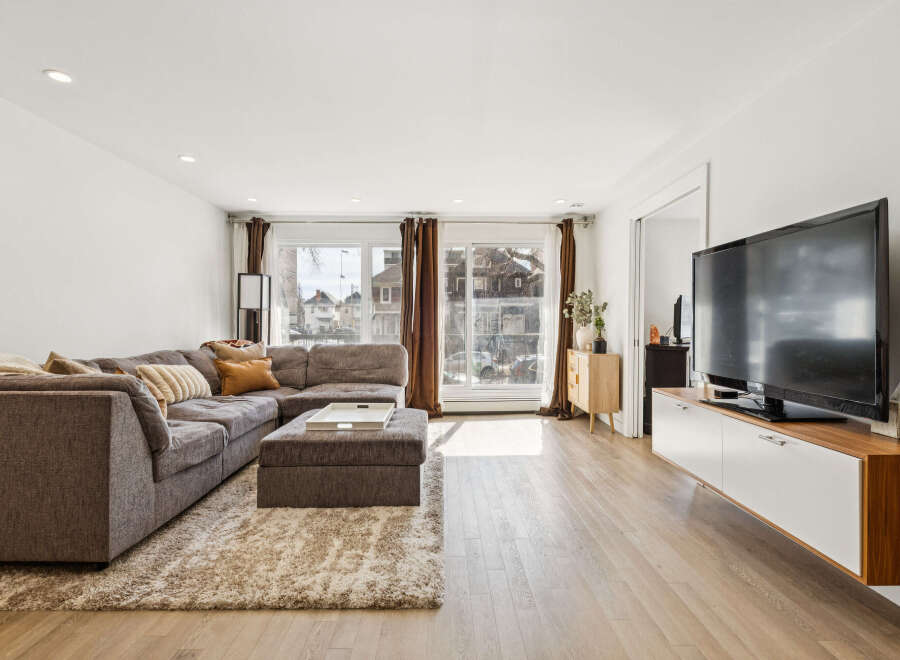 Step into modern living with this stunning property, featuring a spacious living room perfect for entertaining.